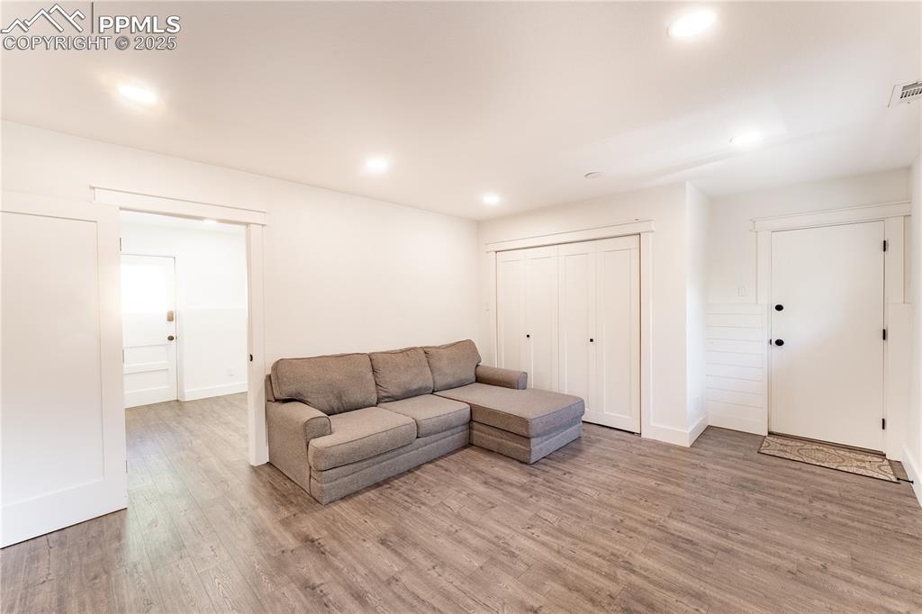 Image 24 of 39: Lower Level Laundry & Living Room Area