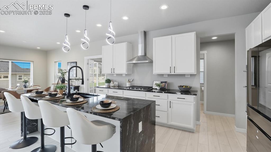 Image 11 of 50: Gourmet Island Kitchen with breakfast bar, waterfall-edge marble-look quart