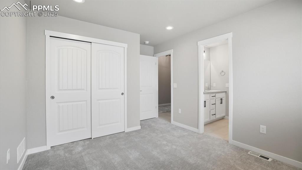 Image 31 of 50: Bedroom #2 located off the front Entry.