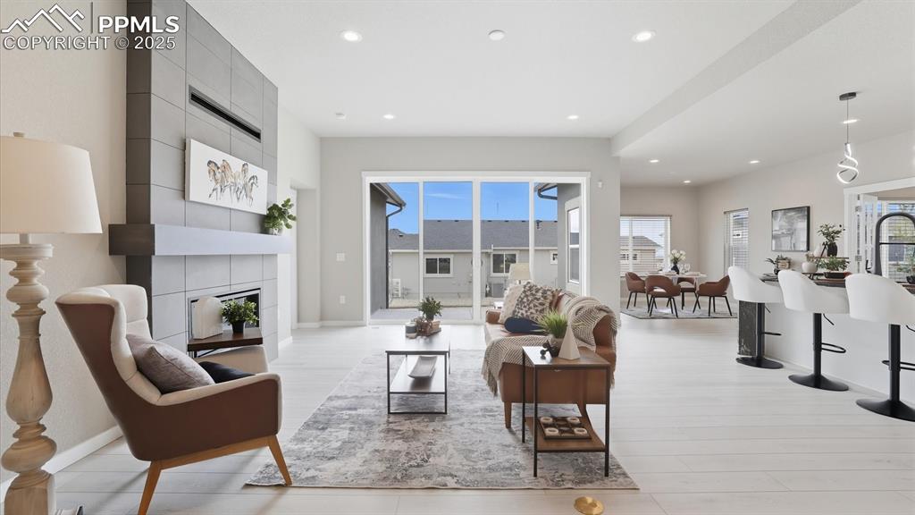 Image 6 of 50: View of the Living Room, Dining Area, and Kitchen.