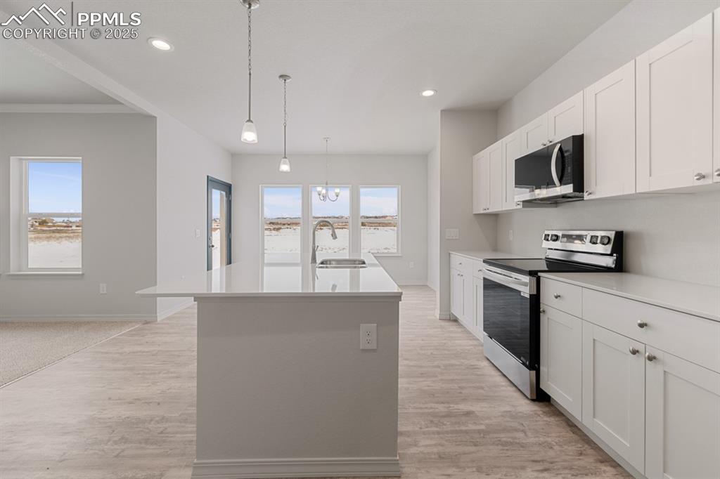 Image 14 of 22: Kitchen featuring stainless steel appliances, plenty of natural light, a ki
