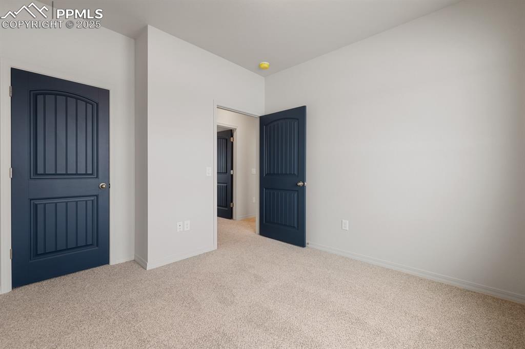 Image 6 of 22: Unfurnished bedroom featuring carpet and baseboards