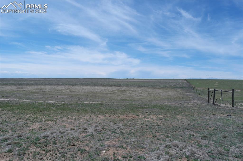 Image 3 of 12: View of yard featuring fence and a rural view