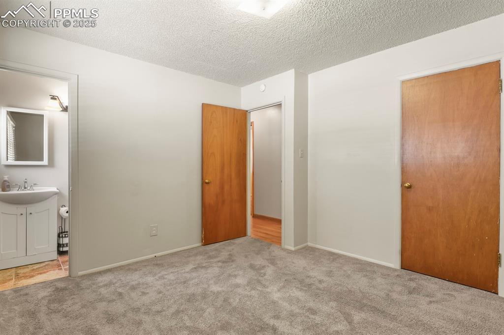 Image 13 of 24:  Primary bedroom and ensuite bath