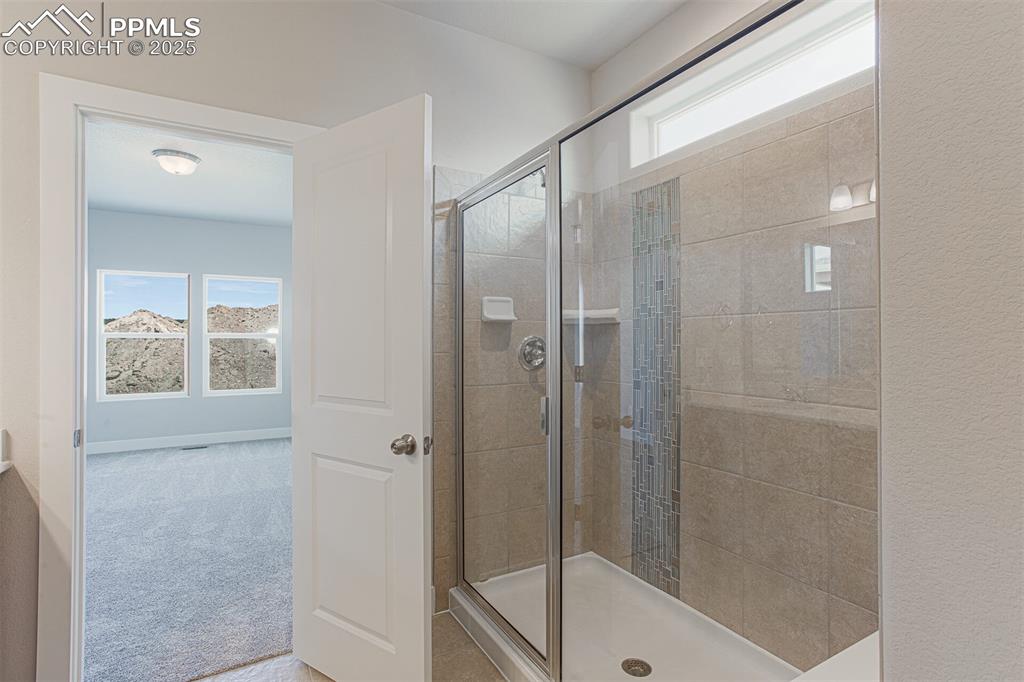 Image 10 of 10: Full bath with a stall shower