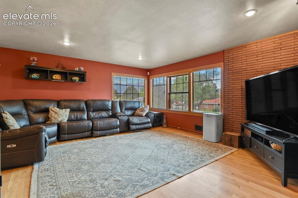 Image 2 of 28: Wood-finish flooring throughout