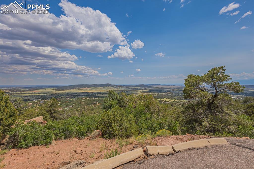 Image 5 of 24: Driveway leading up to paved road.