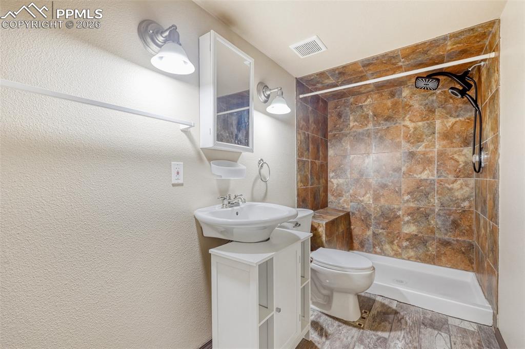 Image 26 of 30: Basement 3/4 Bathroom with heated floors