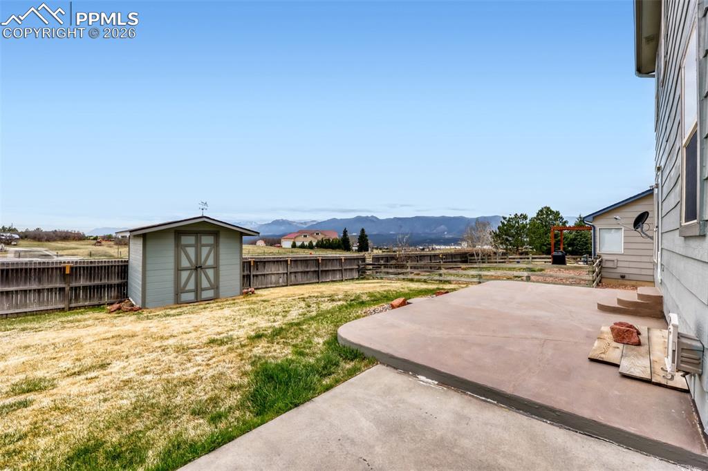 Image 29 of 30: Backyard with view of Pikes Peak