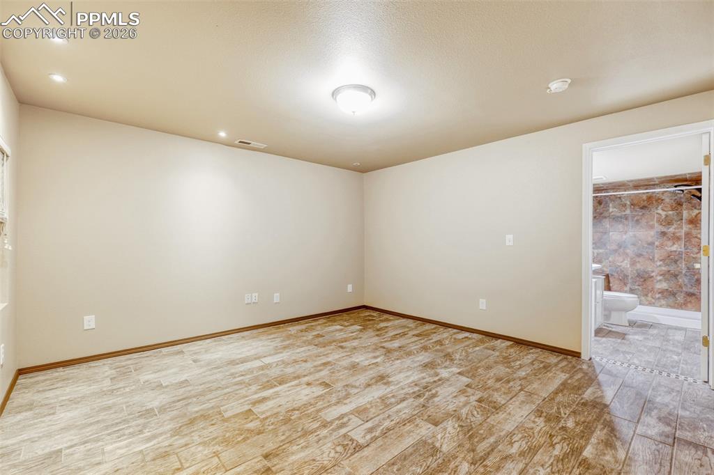 Image 33 of 38: This room is attached to the bathroom both have heated floors, window but n