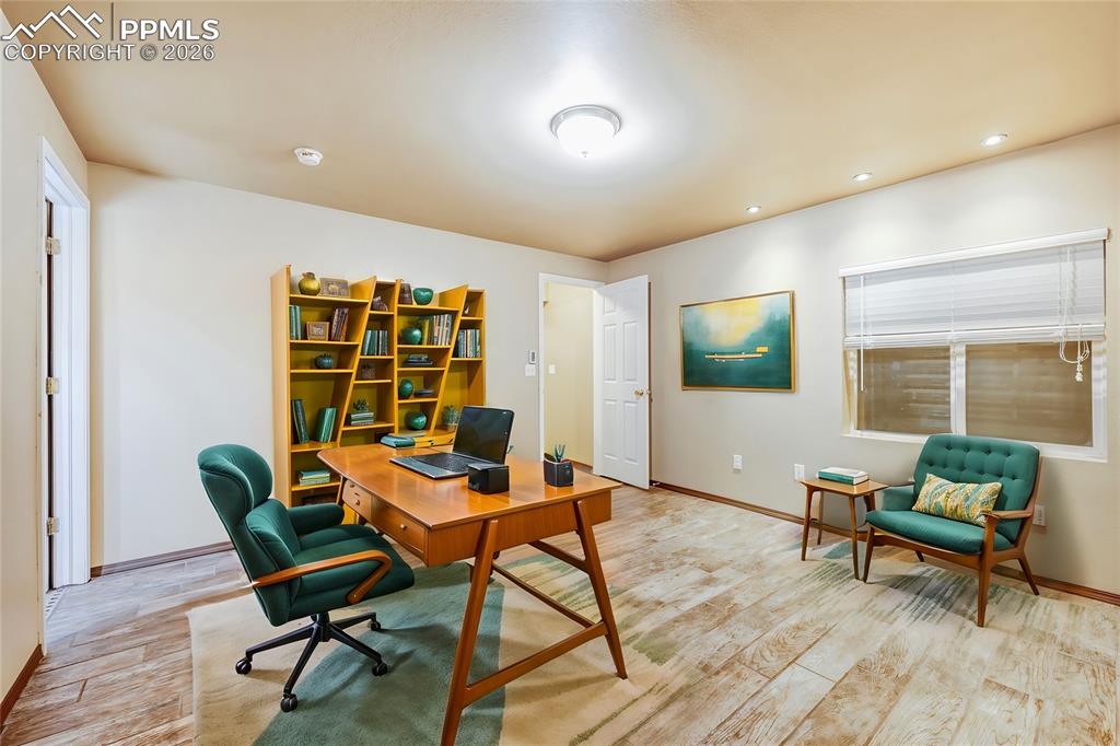 Image 35 of 38: Home office featuring light wood-style flooring and recessed lighting