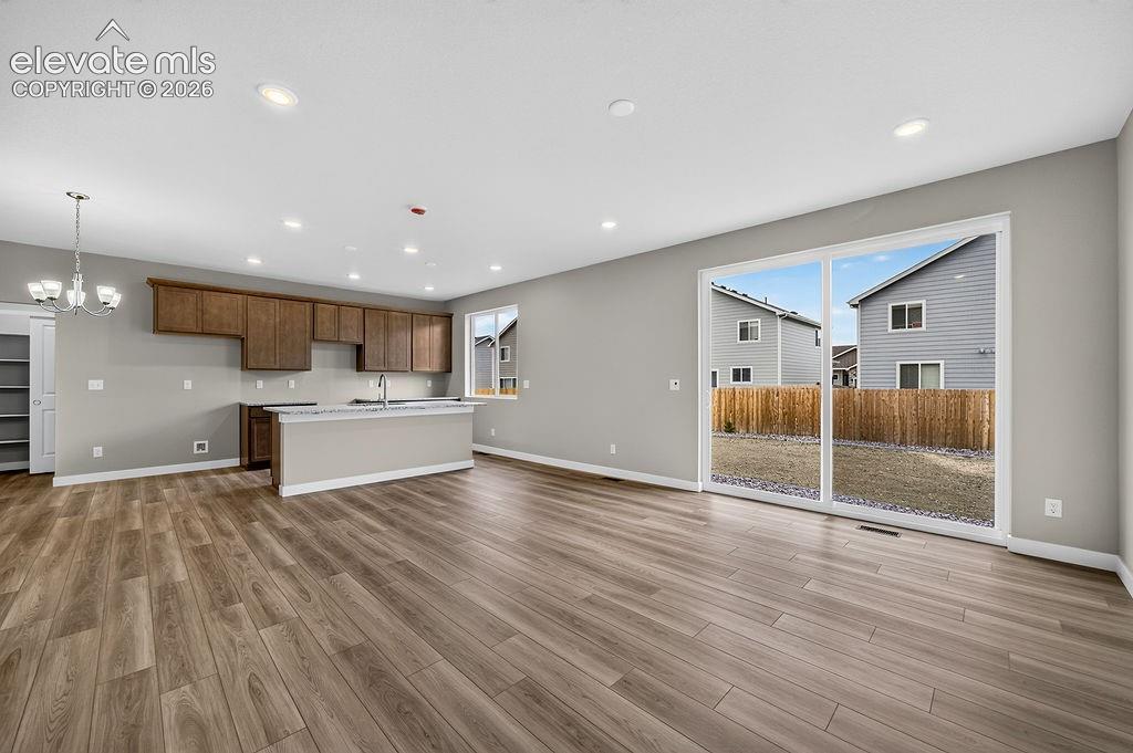 Image 10 of 37: Living Room and Kitchen