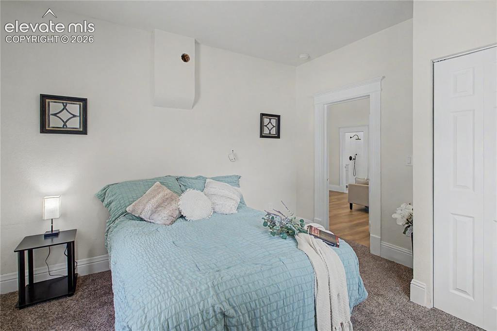 Image 13 of 19: Neutral wall paint with carpet flooring