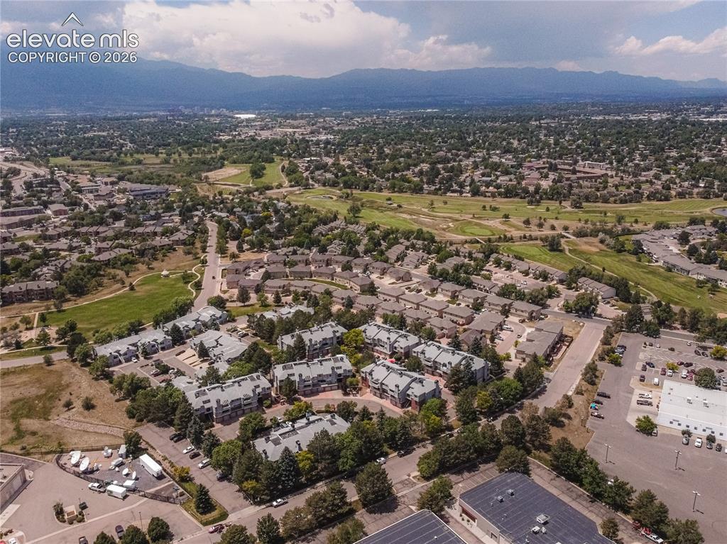 Image 26 of 37: Aerial perspective showcasing a residential community with abundant green s