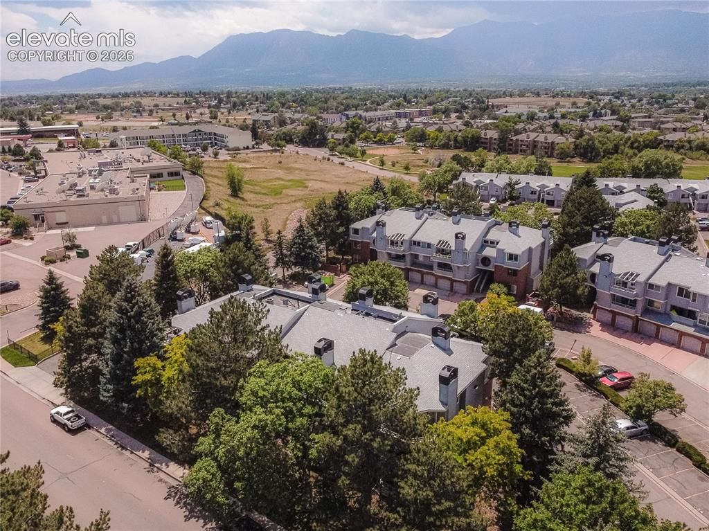 Image 32 of 37: Townhome community featuring multi-story residences with brick and siding e