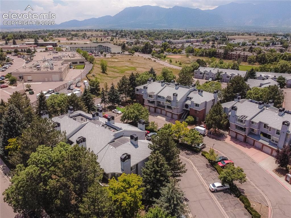 Image 35 of 37: Residential community featuring multiple multi-story buildings with pitched