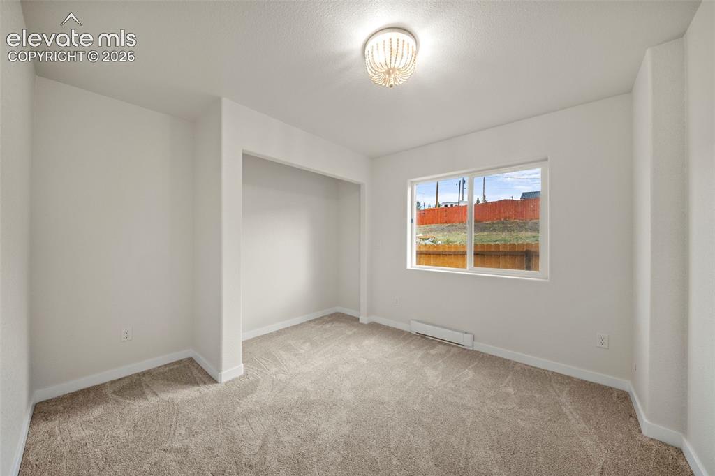 Image 12 of 30: Main-level bedroom