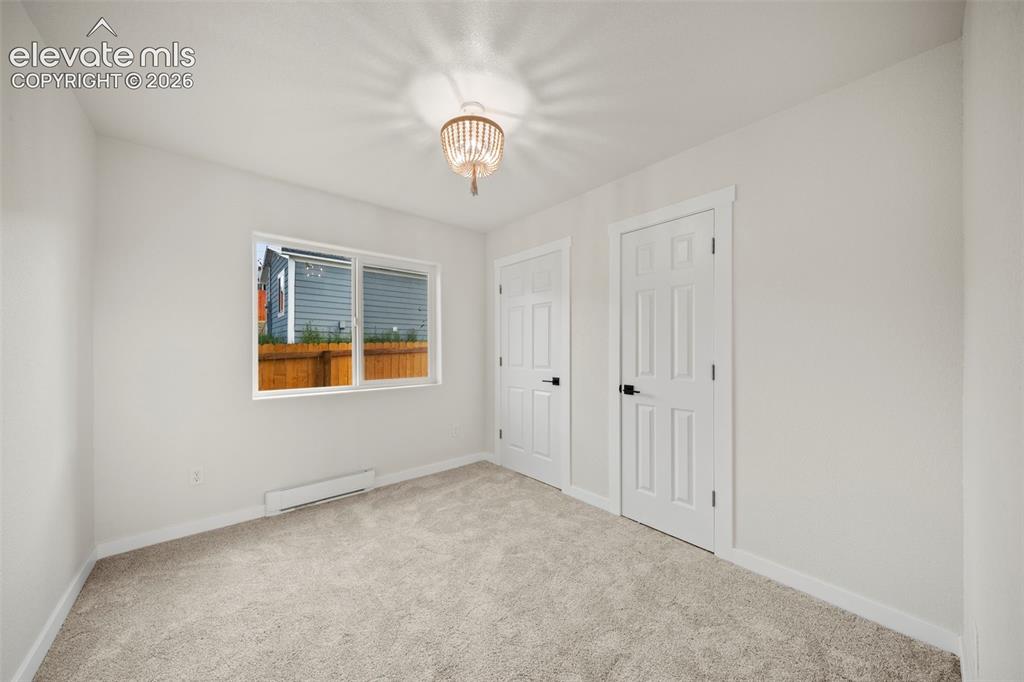 Image 14 of 30: Second main-level bedroom