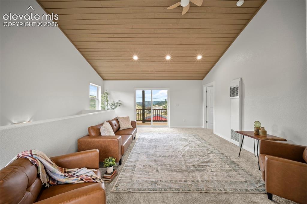 Image 16 of 30: Spacious upper level with tongue-and-groove ceilings