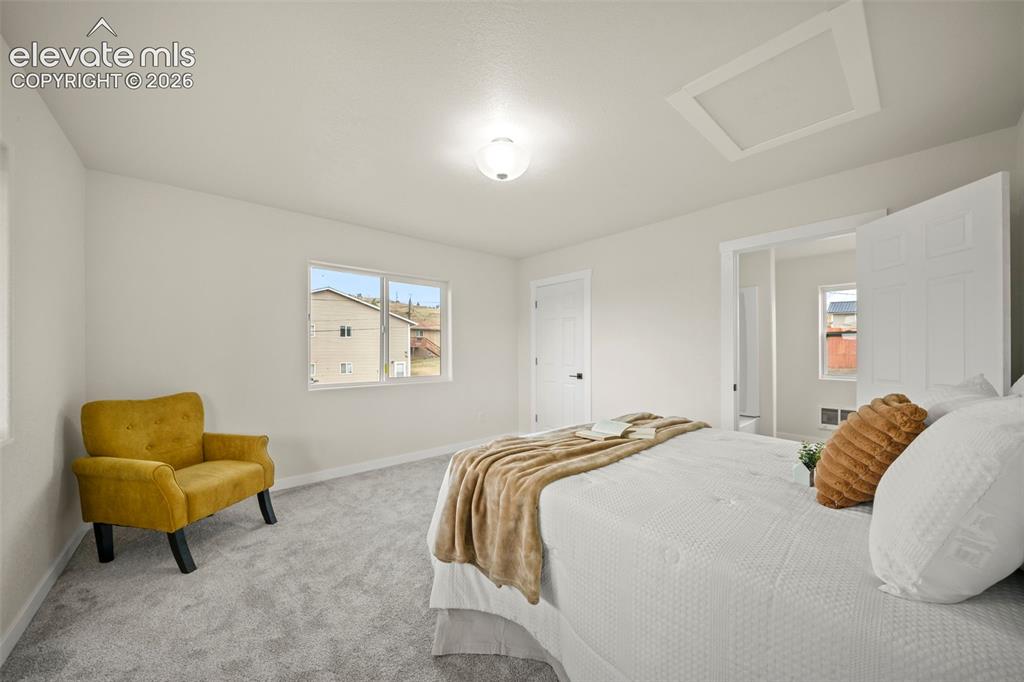 Image 19 of 30: Upper-level primary suite