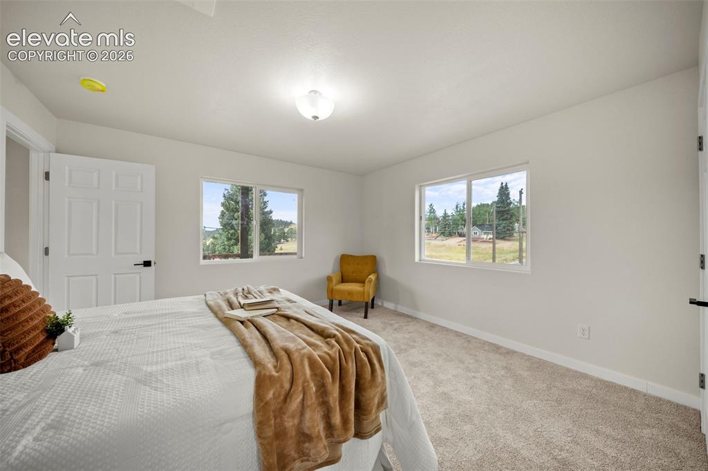 Image 20 of 30: upper-level primary suite