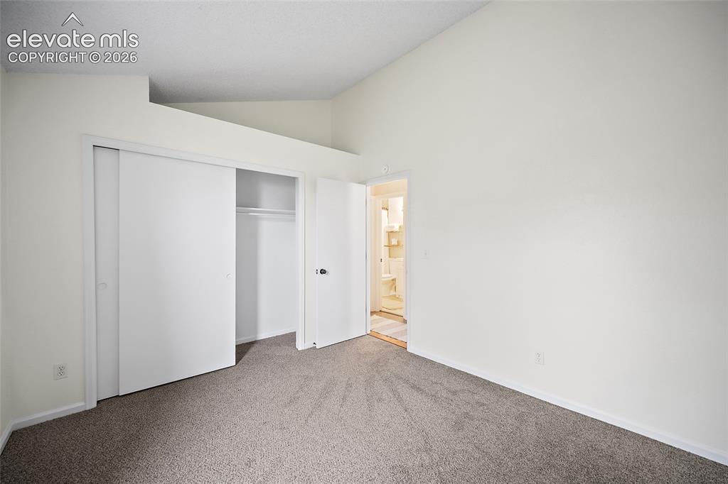 Image 14 of 37: Neutral-toned carpeting paired with white walls