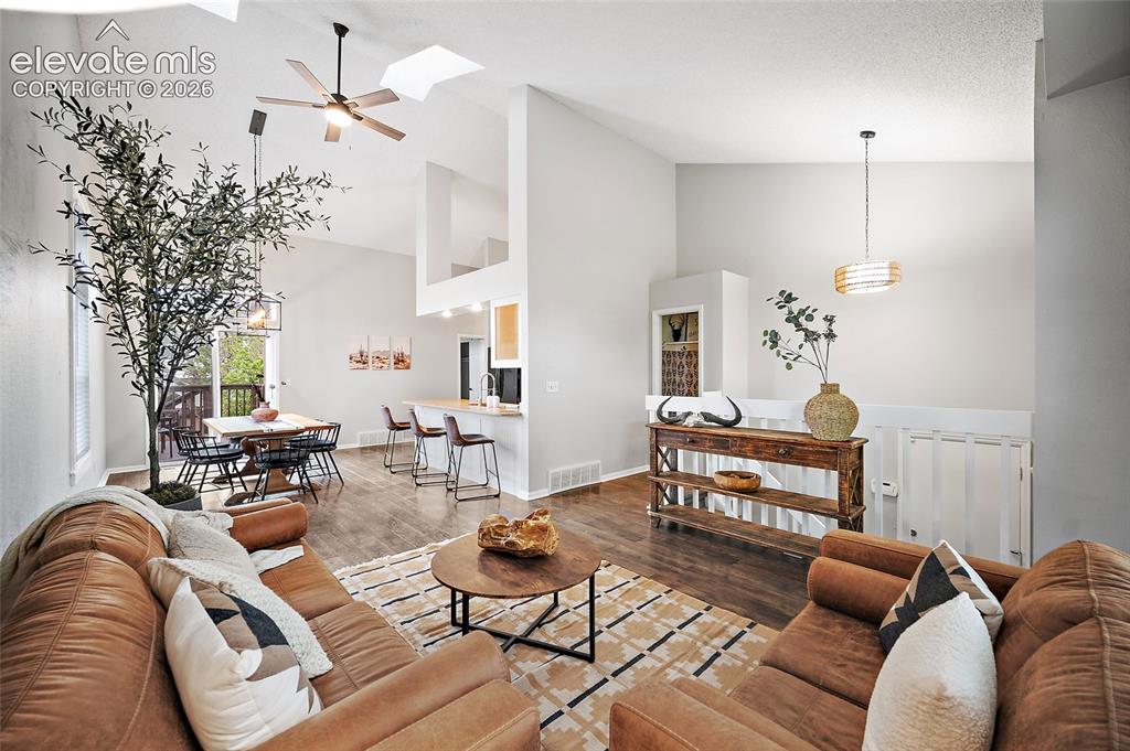 Image 3 of 37: Vaulted ceilings with skylights in the main living area