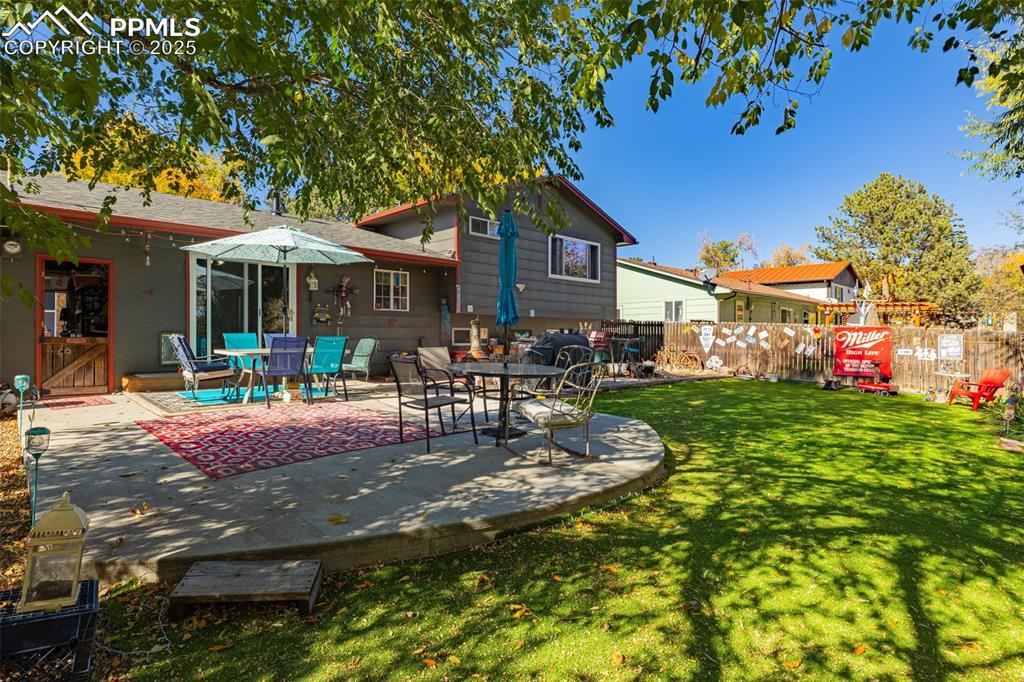 Image 15 of 25: Back of house featuring a patio