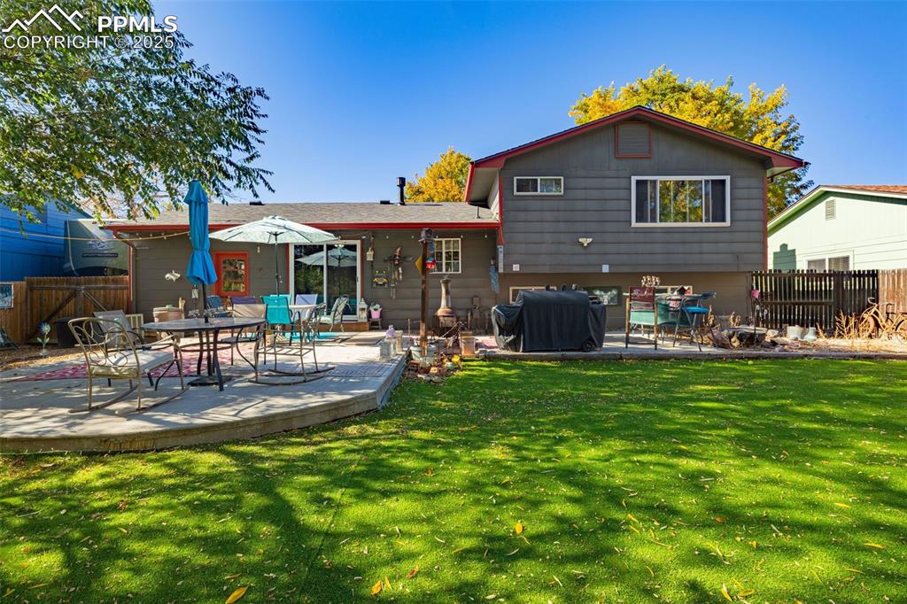 Image 17 of 25: Back of house featuring a patio area