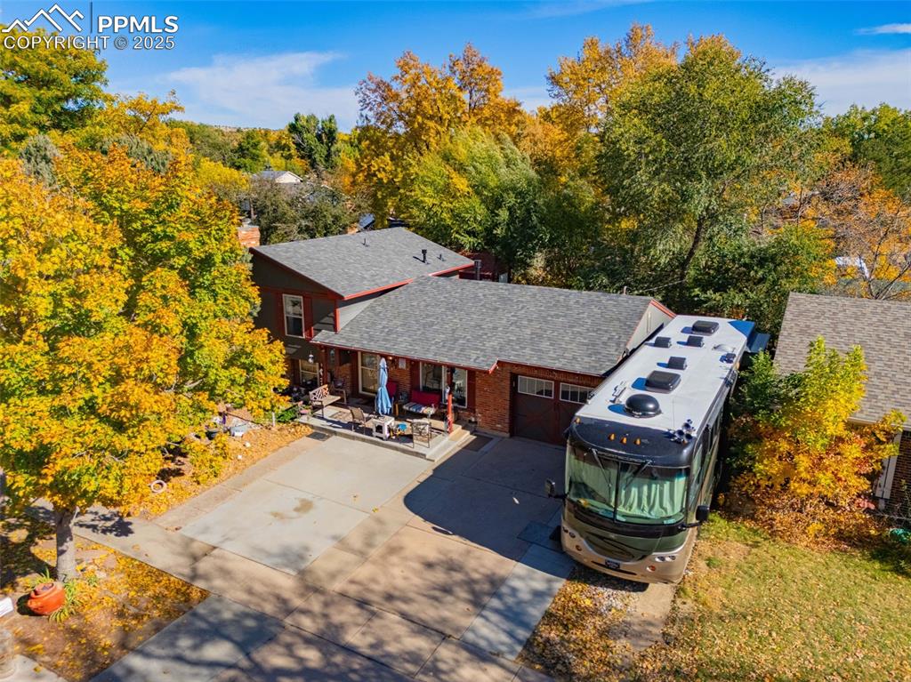 Image 21 of 25: Aerial view of property and surrounding area