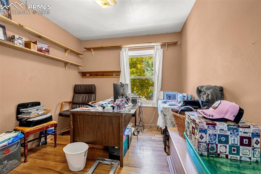 Image 8 of 25: Bedroom featuring light wood-style flooring
