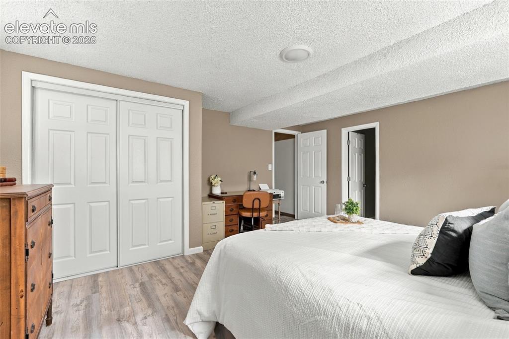 Image 41 of 49: Wood-finish flooring with neutral wall tones