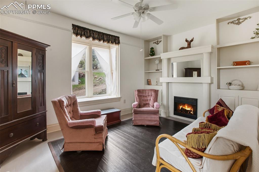 Image 10 of 37: also called living room, note bay window, electric fireplace, nicely done f