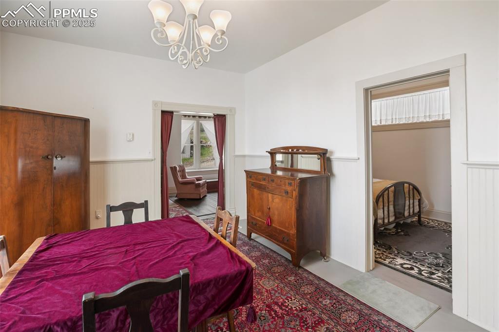 Image 15 of 37: window to the rear, looking toward a bedroom kitchen on the right