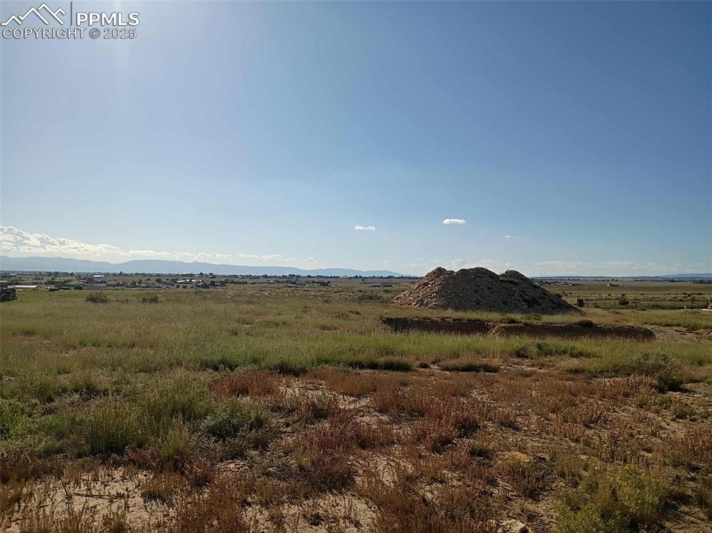 Image 3 of 10: View of mountain backdrop with rural landscape