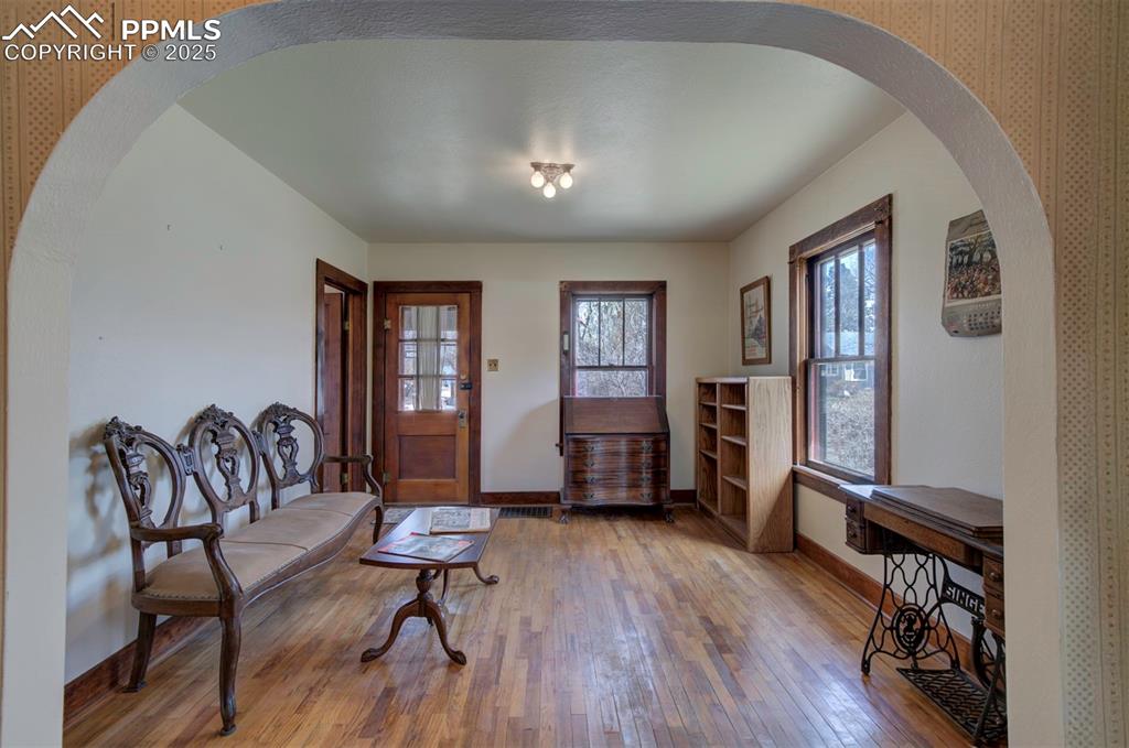 Image 14 of 40: View of living room from dining room