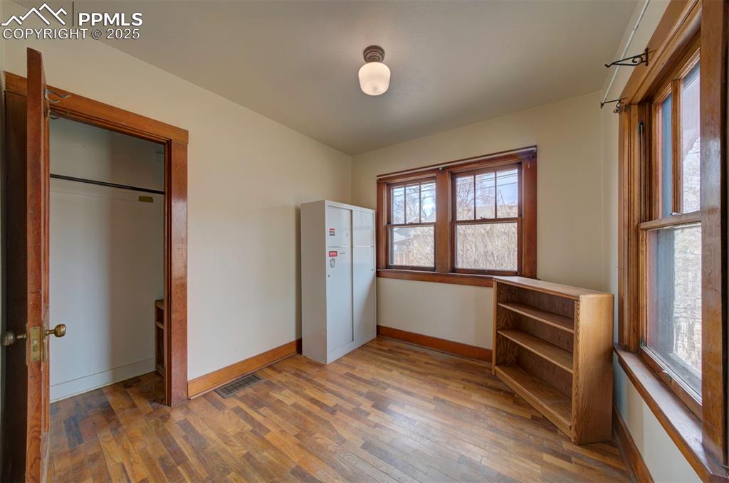 Image 25 of 40: Front bedroom and closet