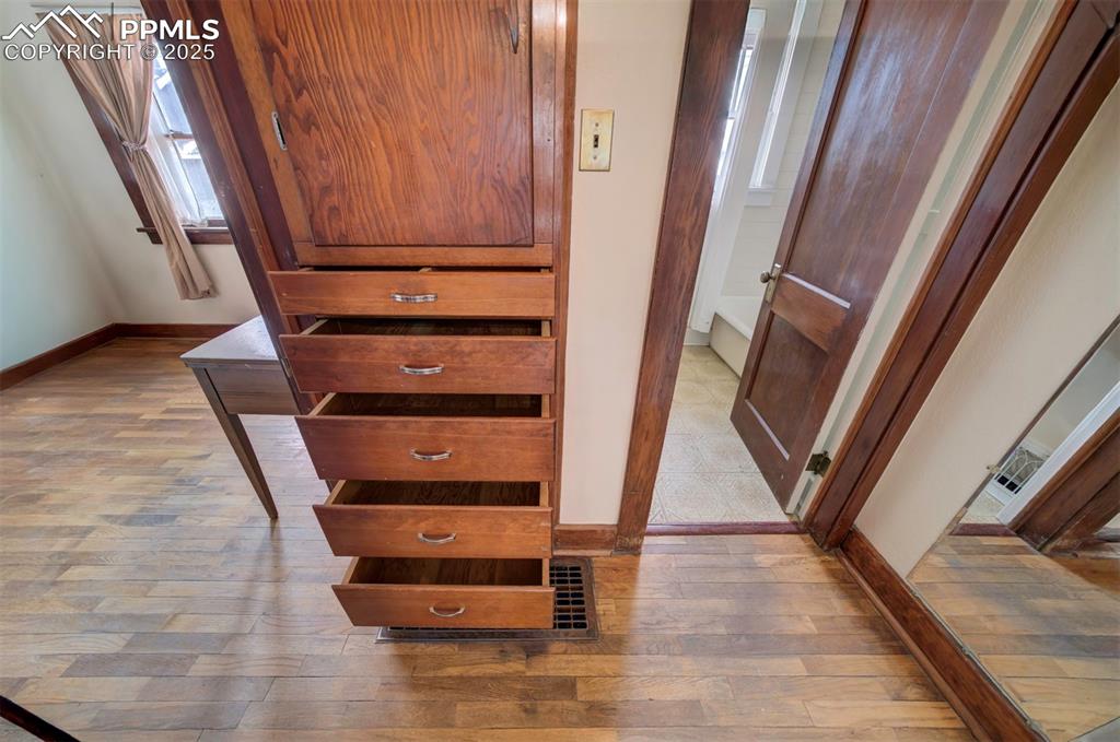 Image 34 of 40: Awesome built-ins between back bedroom and bath
