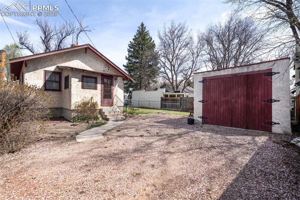 Image 39 of 40: Garage and parking areas.  With access from the alley