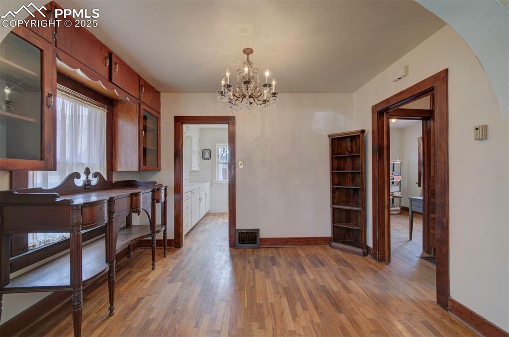 Image 9 of 40: View of dining room, from living room.  Notice the bult in cabinets on the 