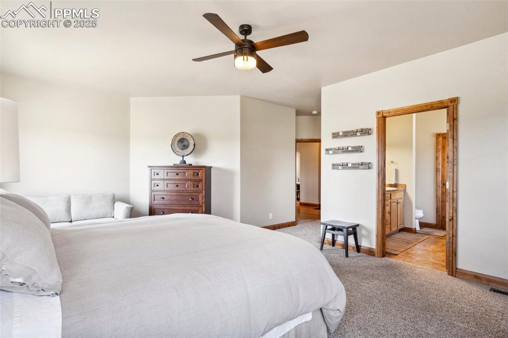 Image 19 of 46: Bedroom featuring ceiling fan, and light carpet