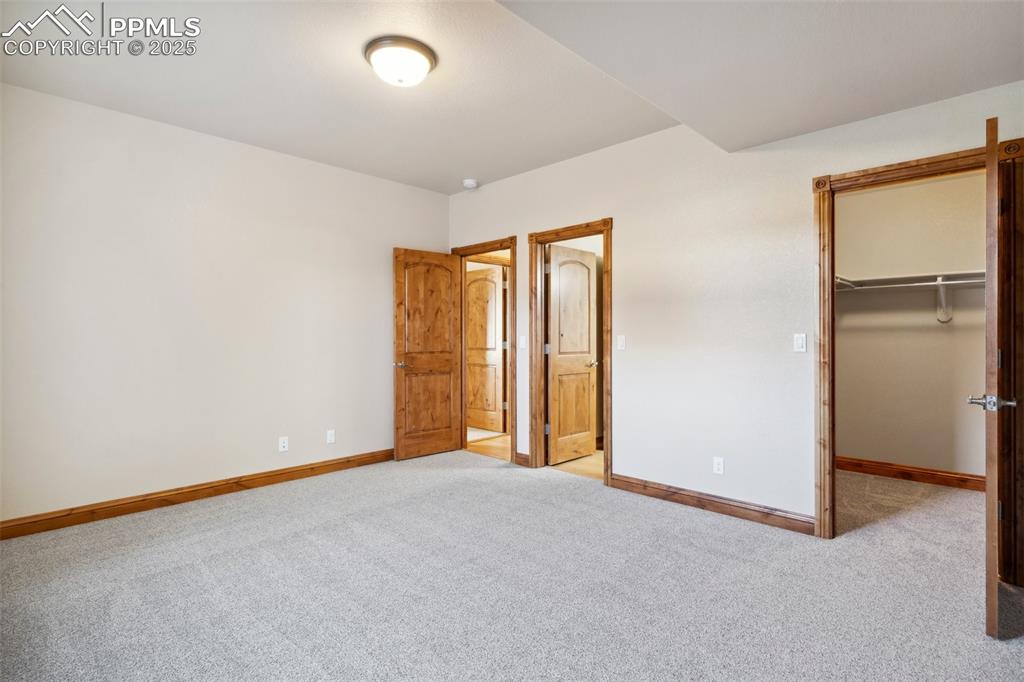 Image 30 of 46: Carpeted spare room