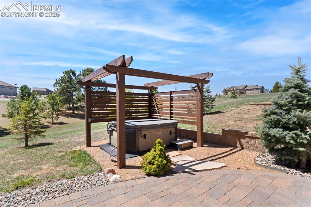 Image 36 of 46: Hot tub with privacy screen