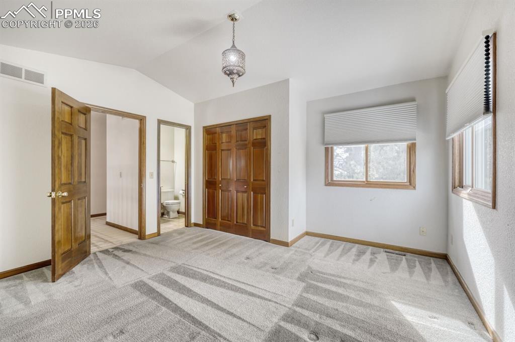 Image 32 of 47: secondary bedroom with ensuite bath