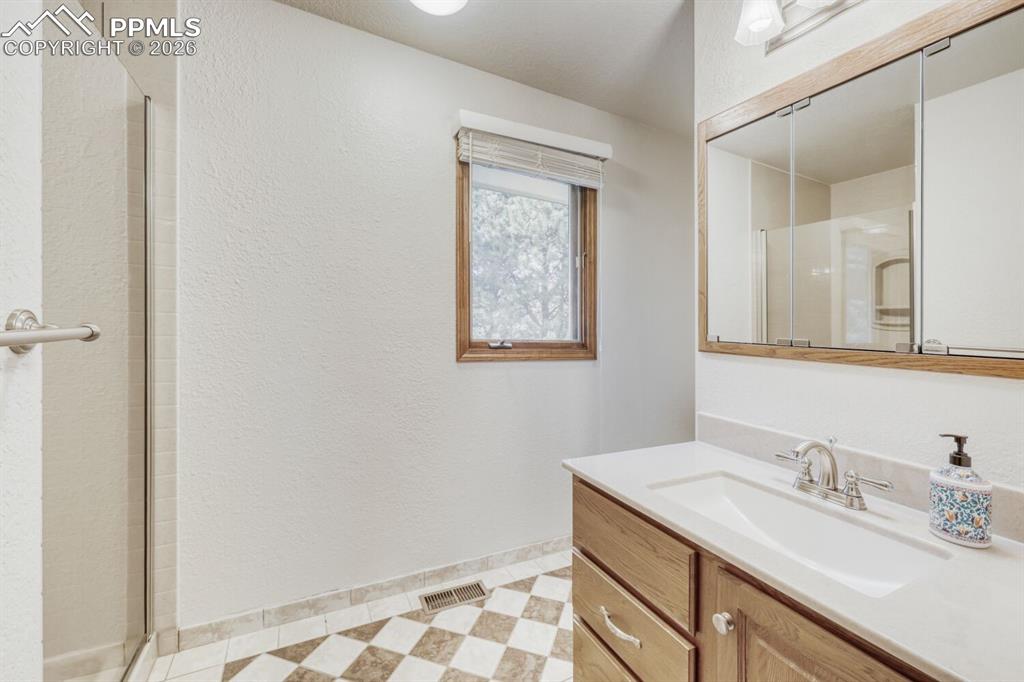 Image 38 of 47: hall bath upper level