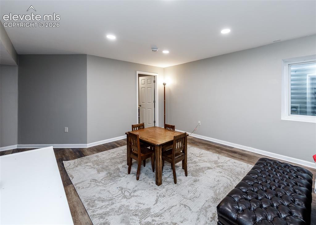 Image 30 of 38: Recessed ceiling lighting, wood-finish flooring, light gray wall finishes, 