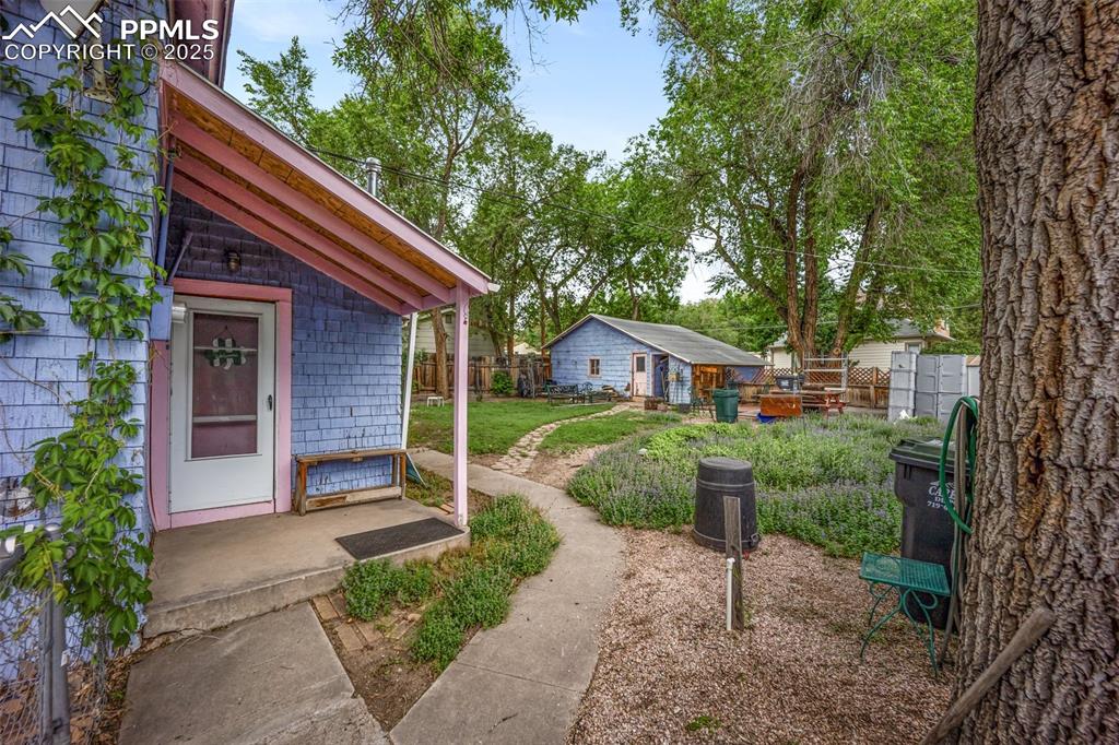 Image 3 of 48: View of yard with an outbuilding