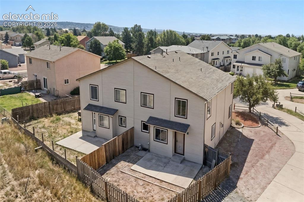 Image 13 of 13: Aerial View of back of Duplex. side of this photo.