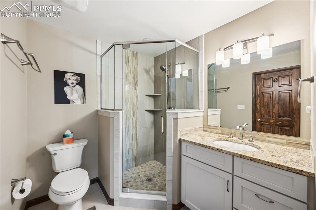 Image 21 of 40: granite countertops, oversize shower with custom tile work