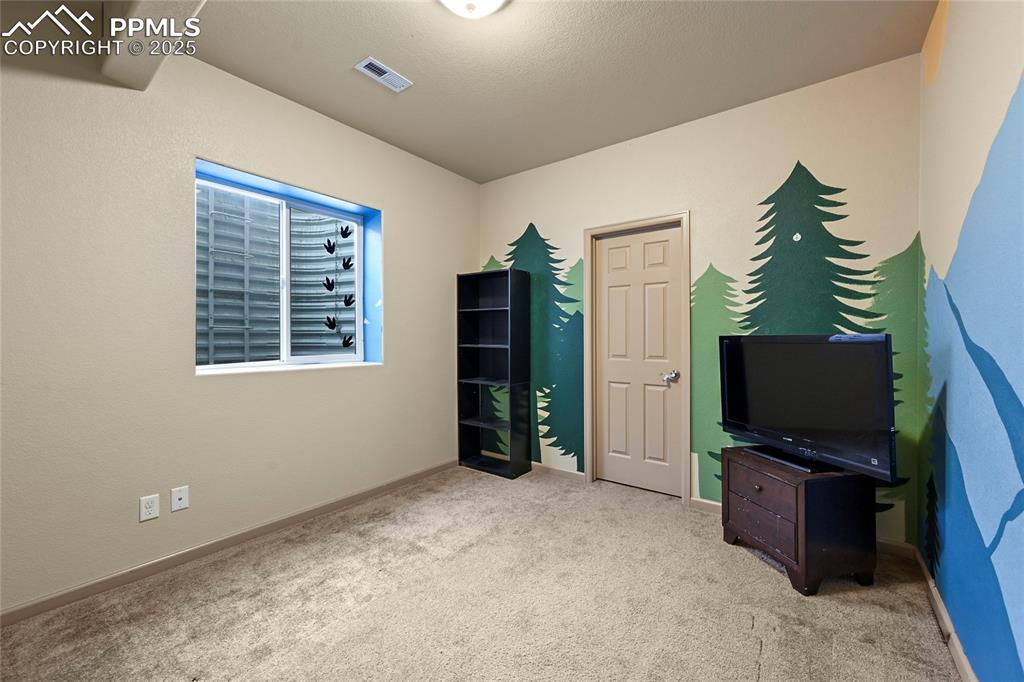 Image 15 of 22: Carpeted bedroom with baseboards and visible vents